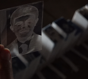 Artist Anıl Olcan, who is working on a micro-memorial for Turkey’s disappeared, is seen holding the negative of a photograph of Seyhan Doğan, one of the seven men who were forcibly disappeared in Dargeçit in 1995, up to the light.